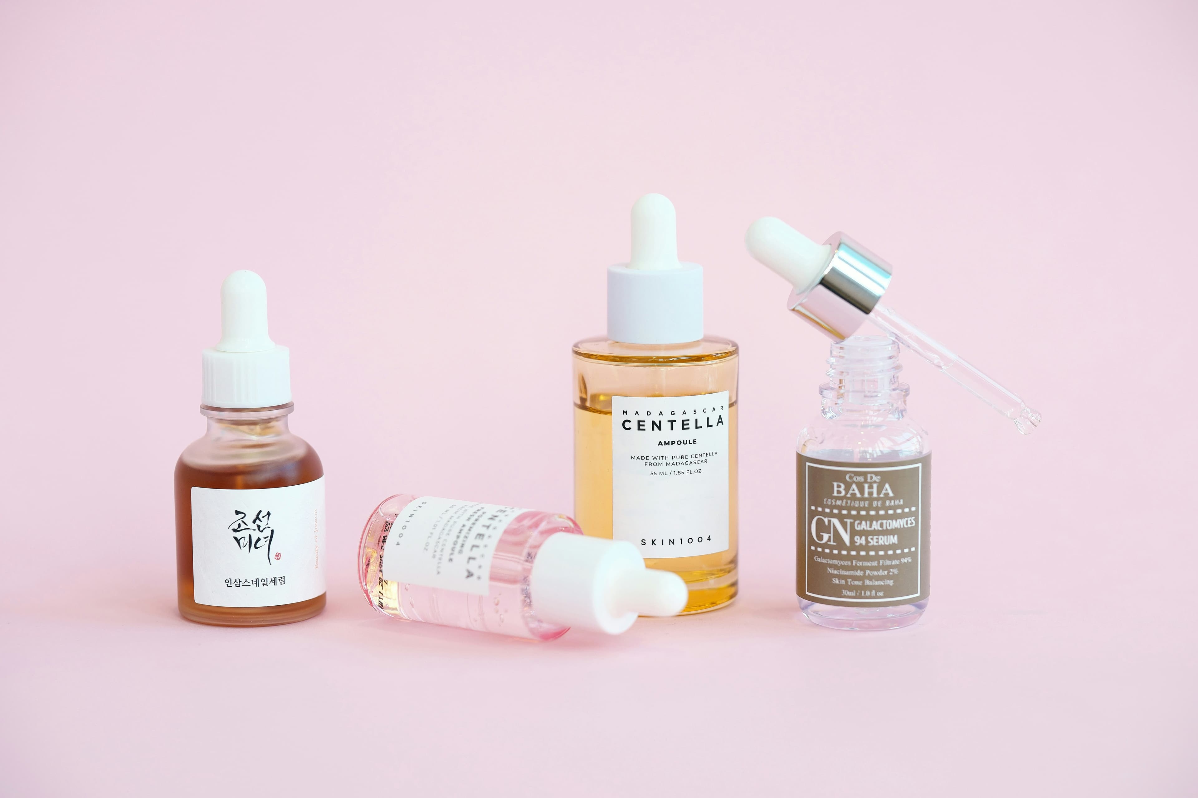 A lineup of serums with their ingredient labels